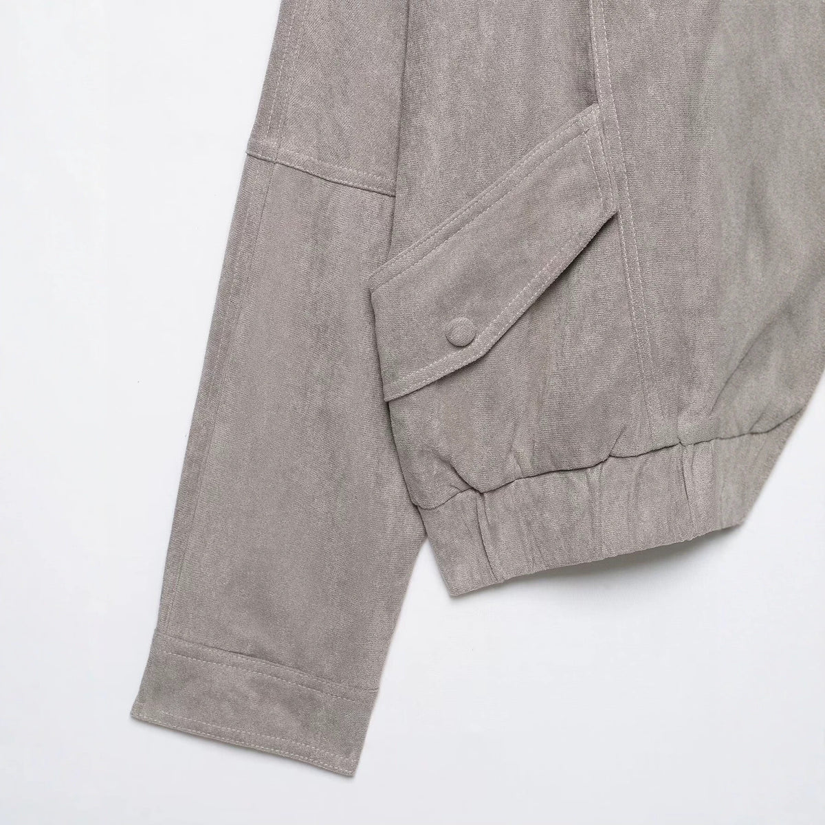 Pocket decoration buckle lapel long sleeved loose jacket women's clothing